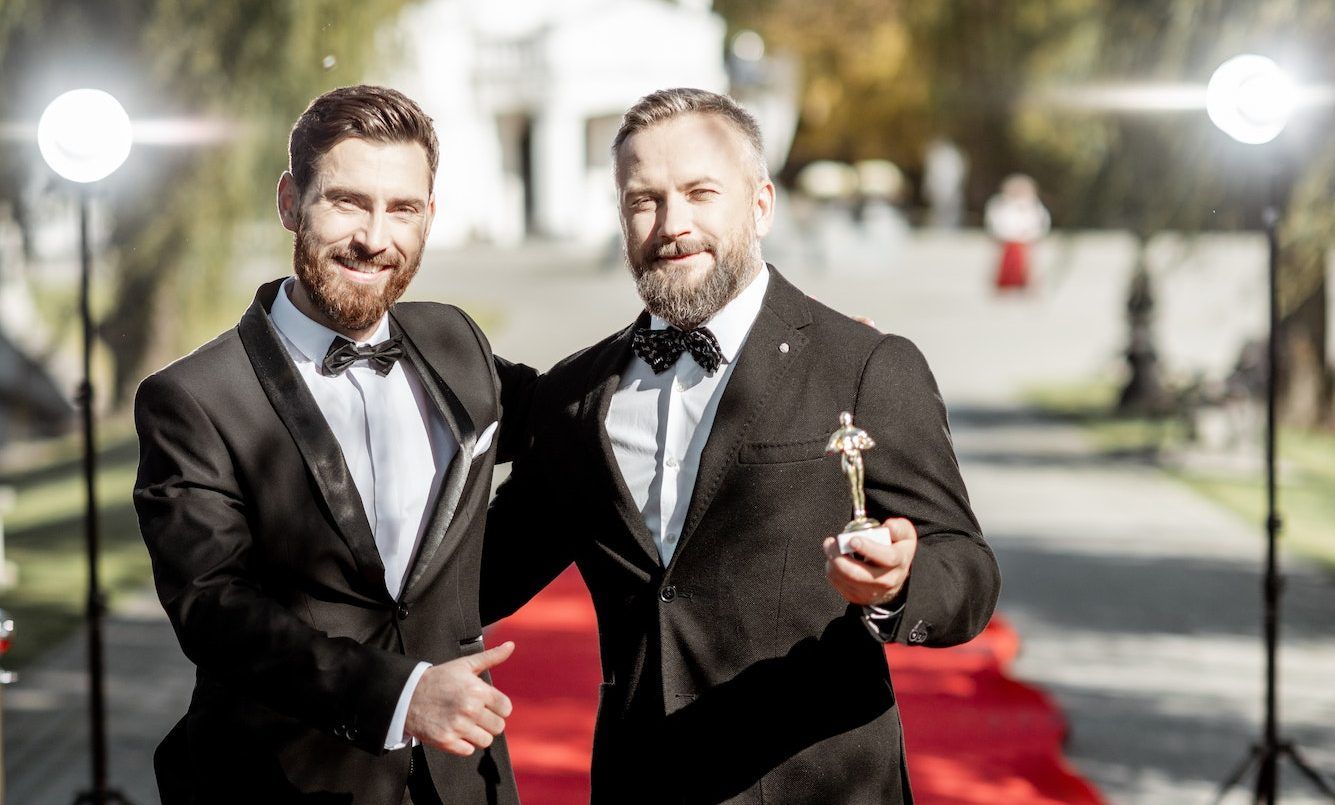Film actors on the red carpet outdoors